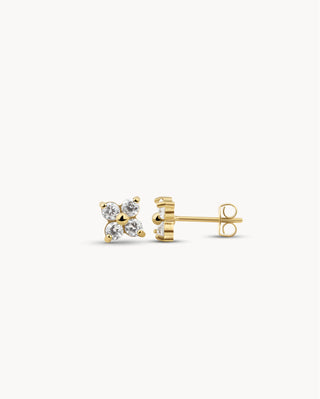Aretes stud dorados con cuatro circones brillantes en forma de flor, waterproof de Pialü