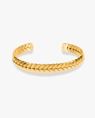 Brazalete rígido abierto dorado con textura trenzada tipo espiga, waterproof de Pialü