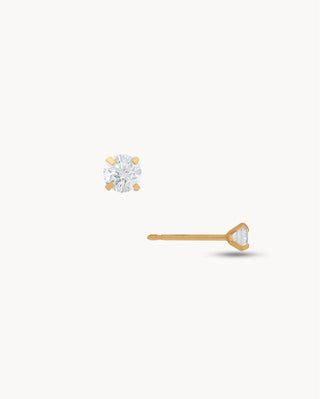 Aretes stud dorados con zircón blanco redondo en montura de 4 garras, joya waterproof de Pialü