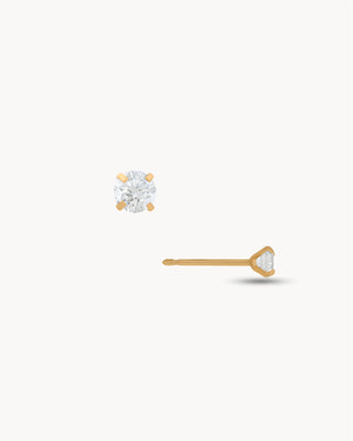 Aretes stud dorados con zircón blanco redondo en montura de 4 garras, joya waterproof de Pialü