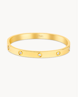 Brazalete rígido dorado con zircones incrustados y cierre click, waterproof de Pialü