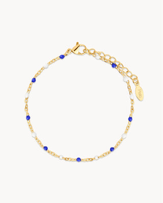 Pulsera dorada con bolitas azules y blancas, joya waterproof de Pialü