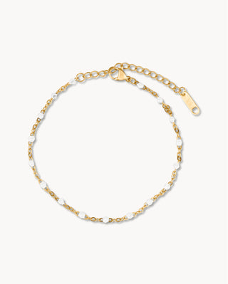 Pulsera dorada con bolitas blancas intercaladas en cadena fina, joya waterproof de Pialü
