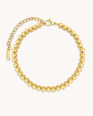 Pulsera de bolitas esféricas doradas waterproof de Pialü, vista frontal