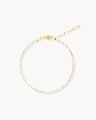 Pulsera tennis fina con zircones blancos en montura dorada waterproof de Pialü